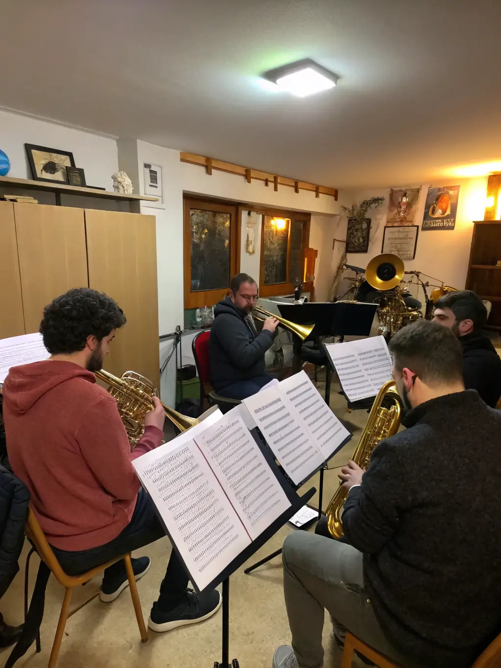 A rehearsal session in progress, with musicians and singers working together to perfect their performance.